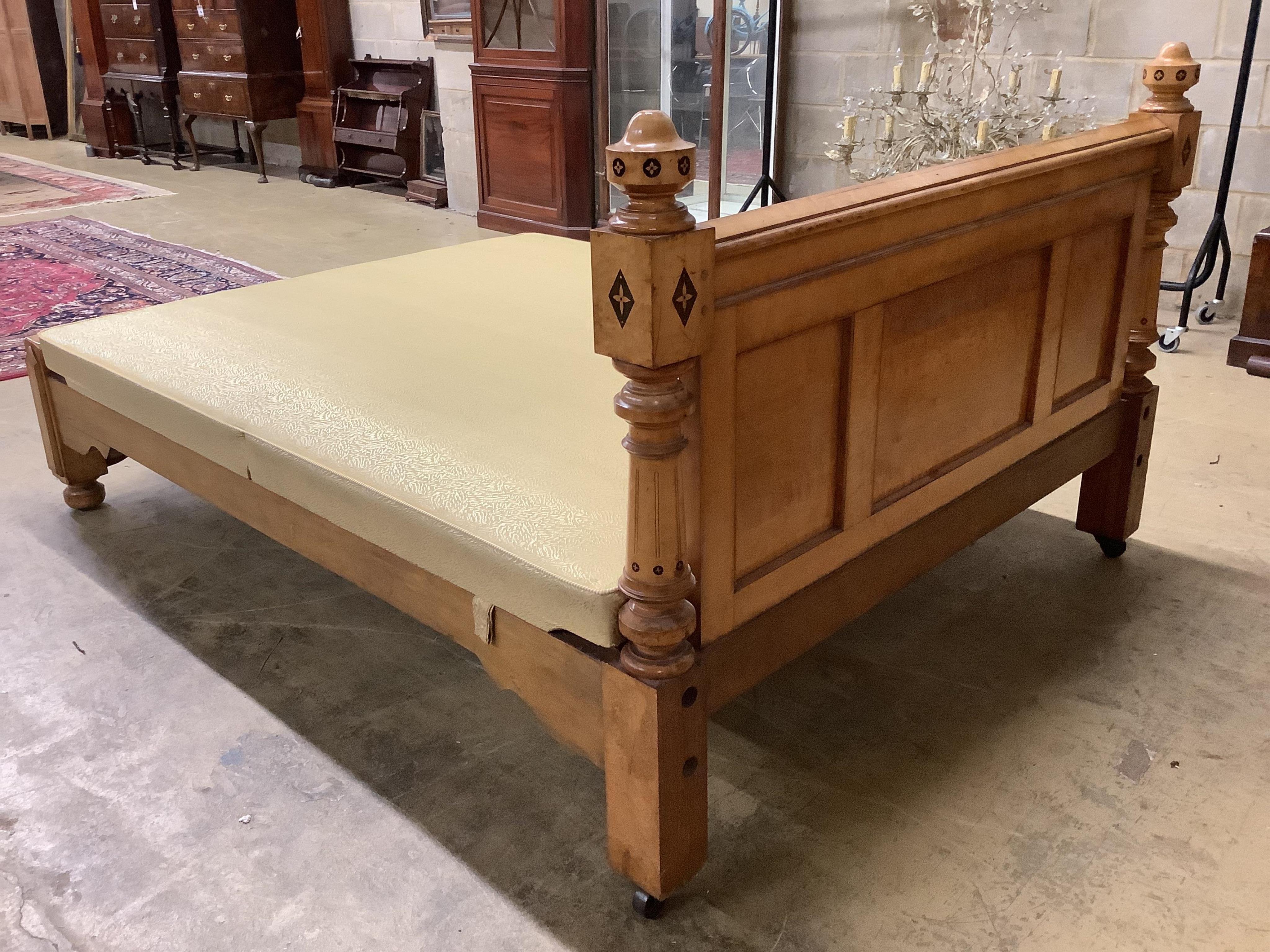 A late Victorian Gothic revival ebony inlaid, bird's eye maple bedroom suite, manner of Charles Bevan, comprising 5ft bed frame, kneehole dressing table, chest of drawers, marble top washstand, bedside cabinet, commode a